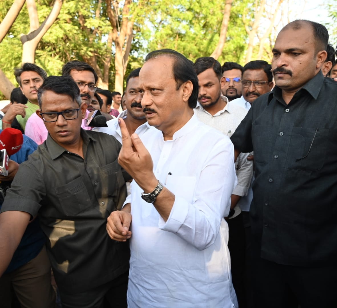 Ajit Pawar, his wife Sunetra Pawar and mother Asha Pawar vote in Katewadi polling centre